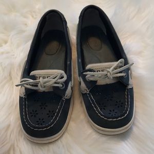 Navy blue sperrys with white ties